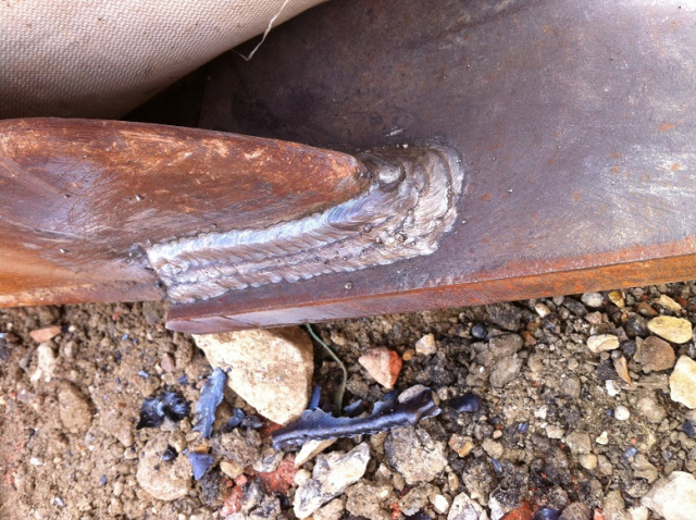 Coded Welder. Excavator bucket mobile on site welding repairs